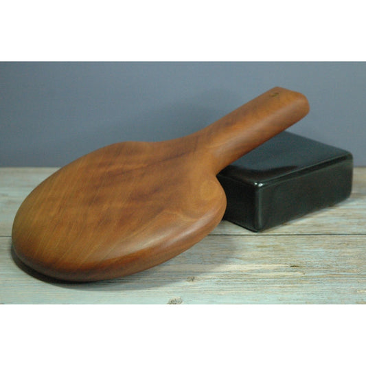 Handcrafted cherrywood paddle designed for thuddy impact sensations.